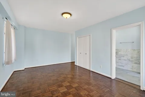 a bathroom with a double vanity sink toilet and shower