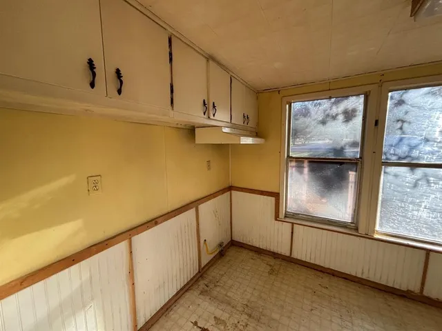 an empty room with windows