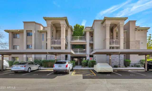 a dining room with wooden floor a glass table and chairs