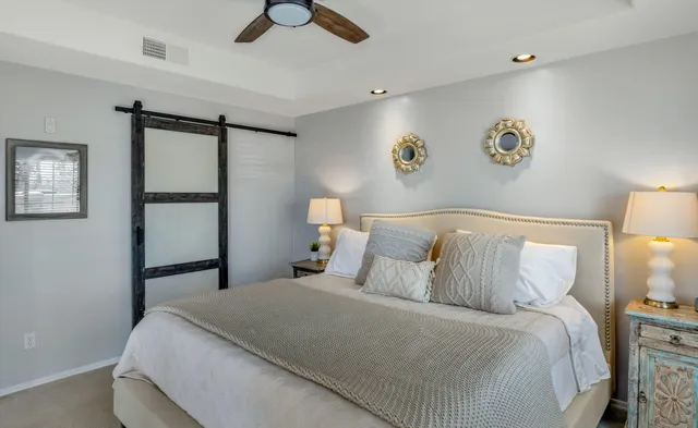 a bathroom with a double vanity sink mirror and shower