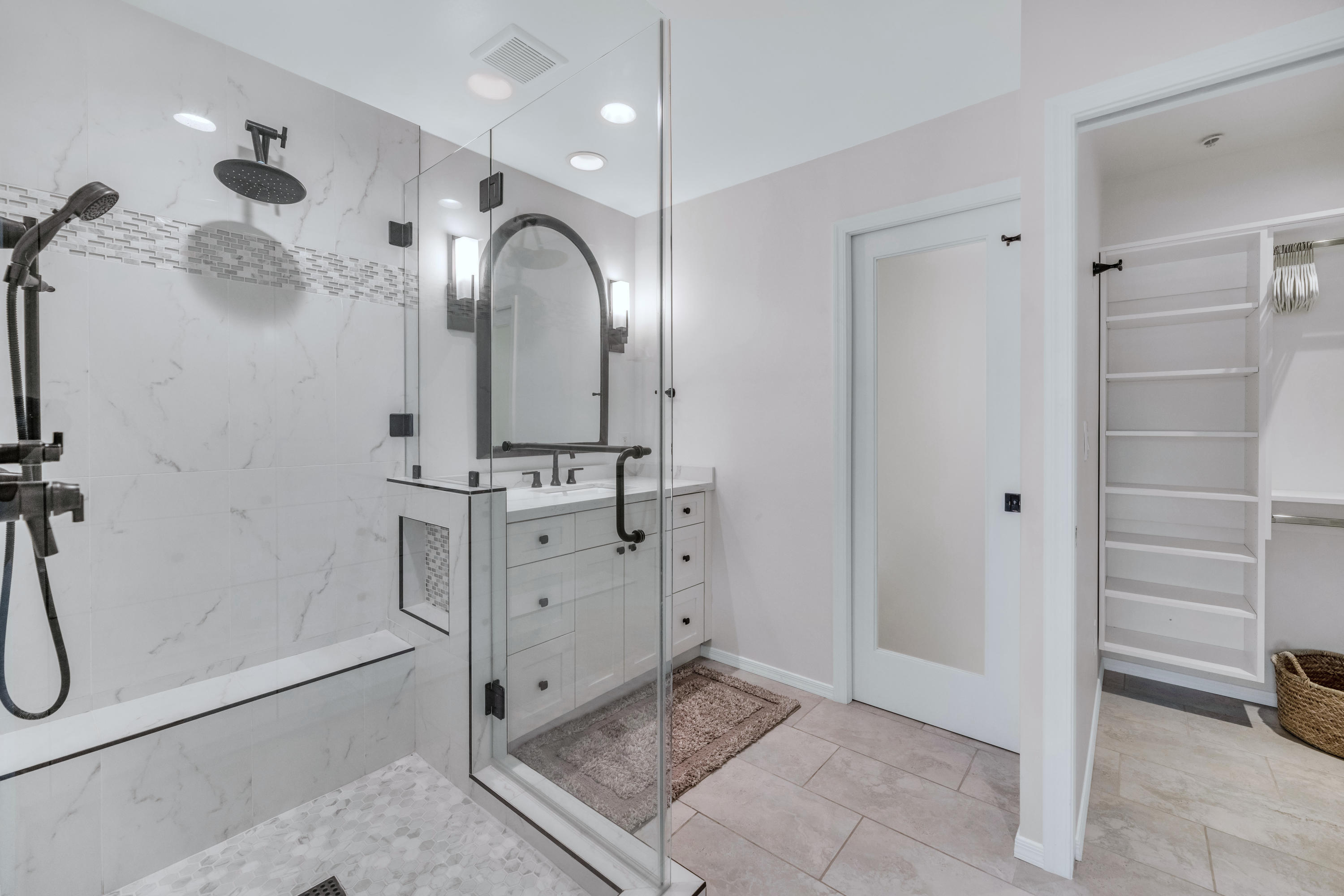 7609 East Indian Bend Road, Unit 1015 Scottsdale, AZ 85250 - Photo 14 of 30 a bathroom with a double vanity sink a mirror and a shower