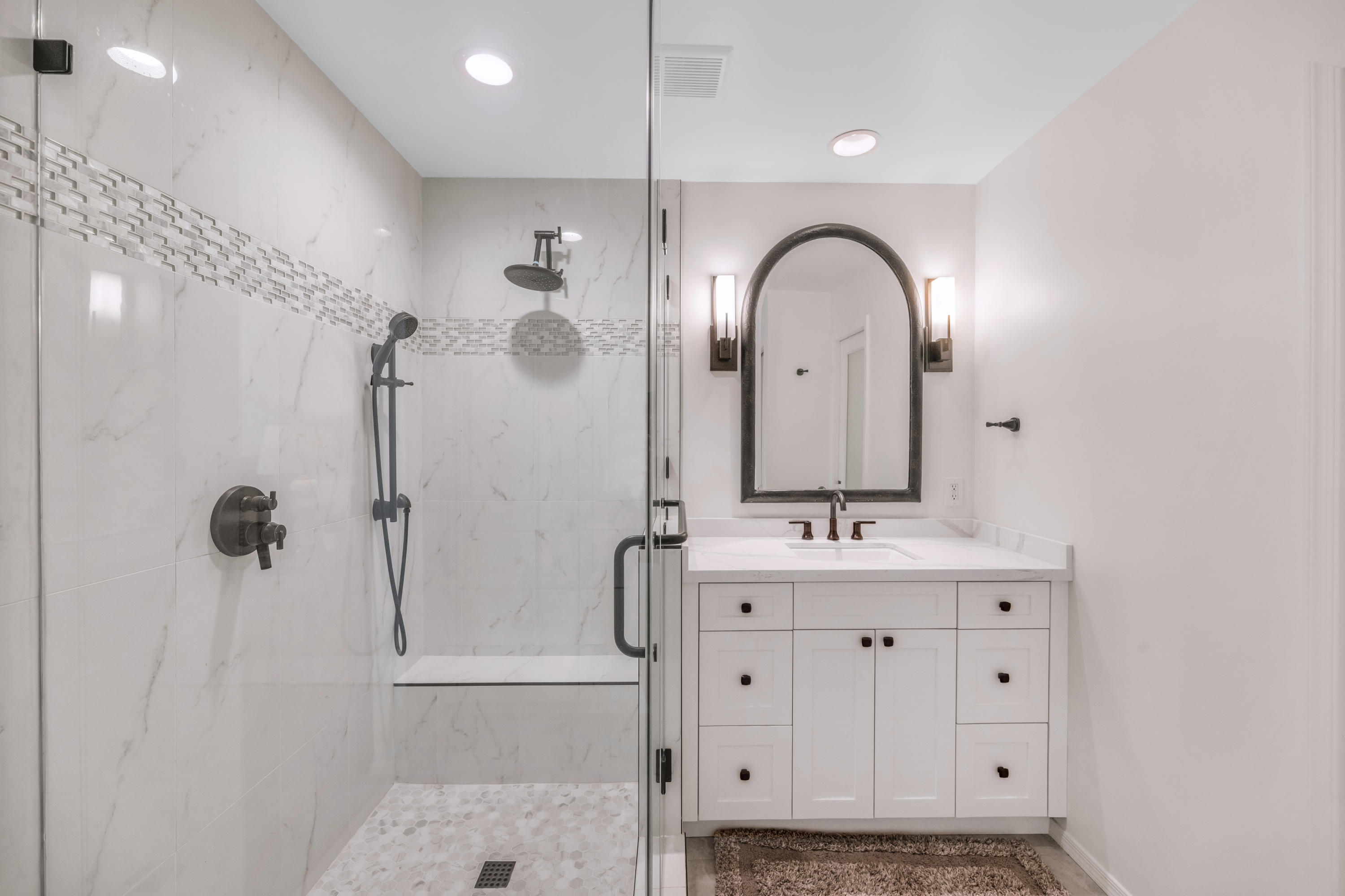 7609 East Indian Bend Road, Unit 1015 Scottsdale, AZ 85250 - Photo 16 of 30 a bathroom with a double vanity sink mirror and shower