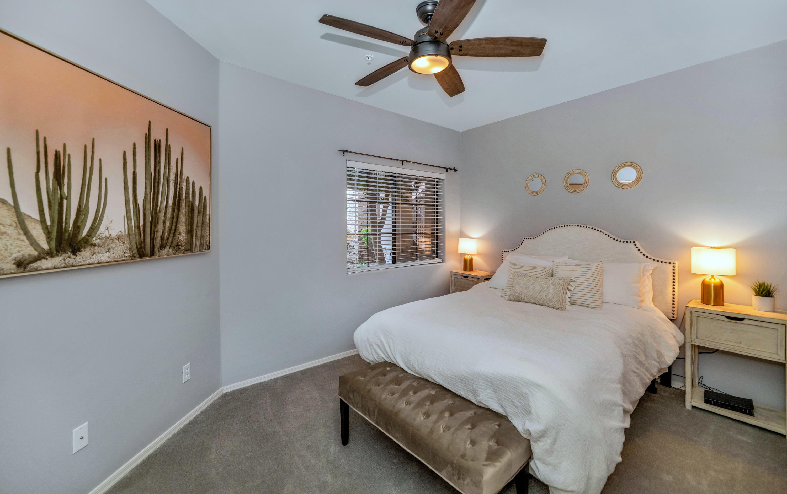 7609 East Indian Bend Road, Unit 1015 Scottsdale, AZ 85250 - Photo 17 of 30 a bedroom with a bed and a chandelier