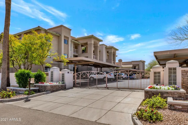 a view of a house with pool and sitting area