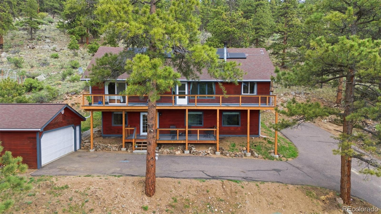 202 Badger Lane Bailey, CO 80421 - Photo 1 of 50 front view of a house with a porch
