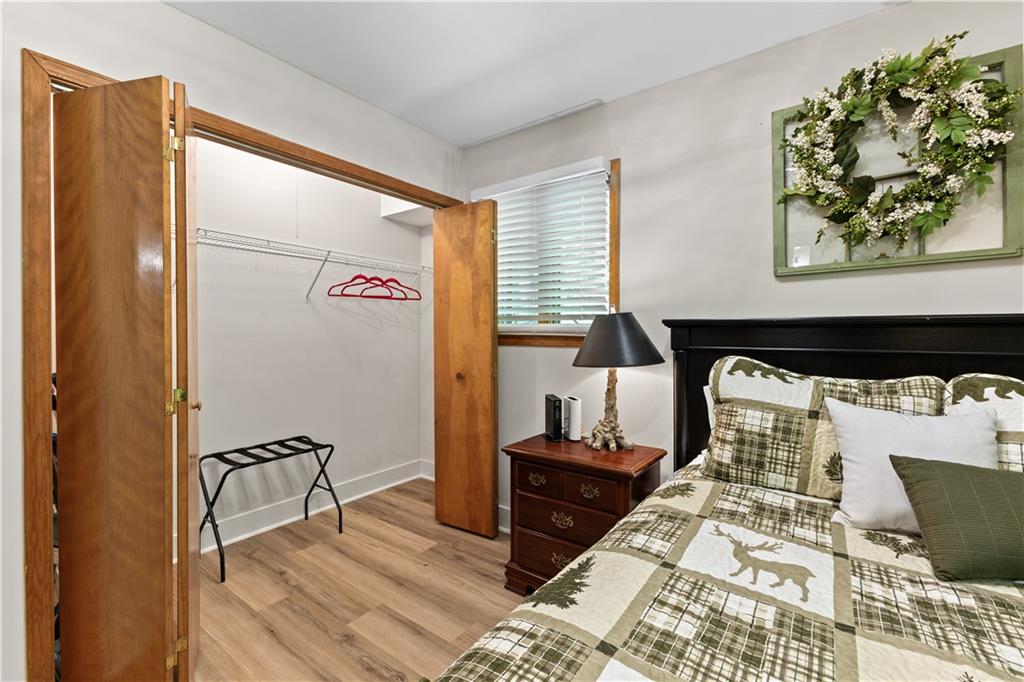 49 Baum Weg Helen, GA 30545 - Photo 22 of 47 a bedroom with a bed and wooden floor