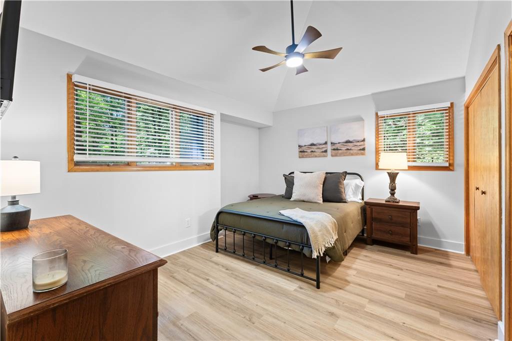 49 Baum Weg Helen, GA 30545 - Photo 26 of 47 a bedroom with a bed wooden floor and a window