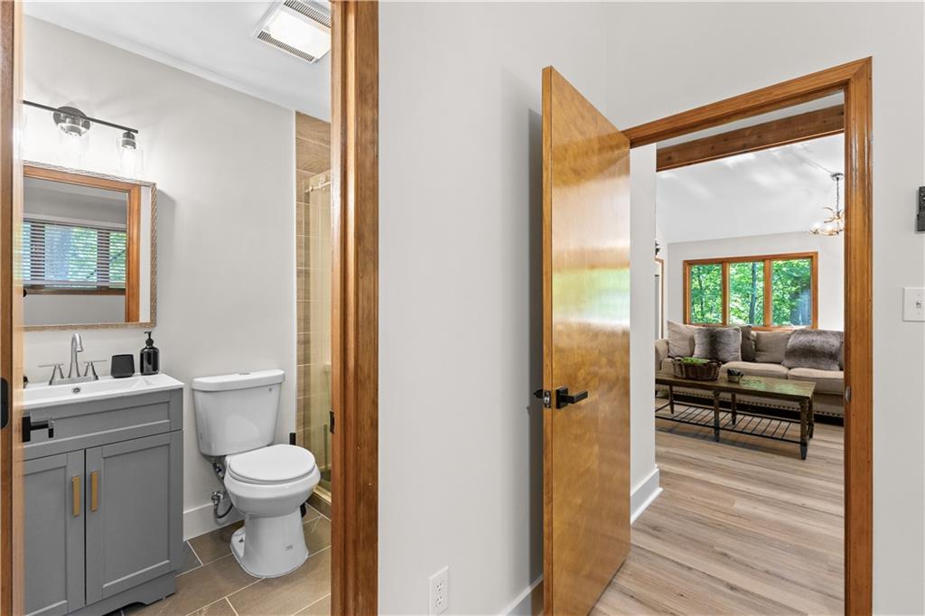 49 Baum Weg Helen, GA 30545 - Photo 28 of 47 a bathroom with a toilet a sink and a mirror