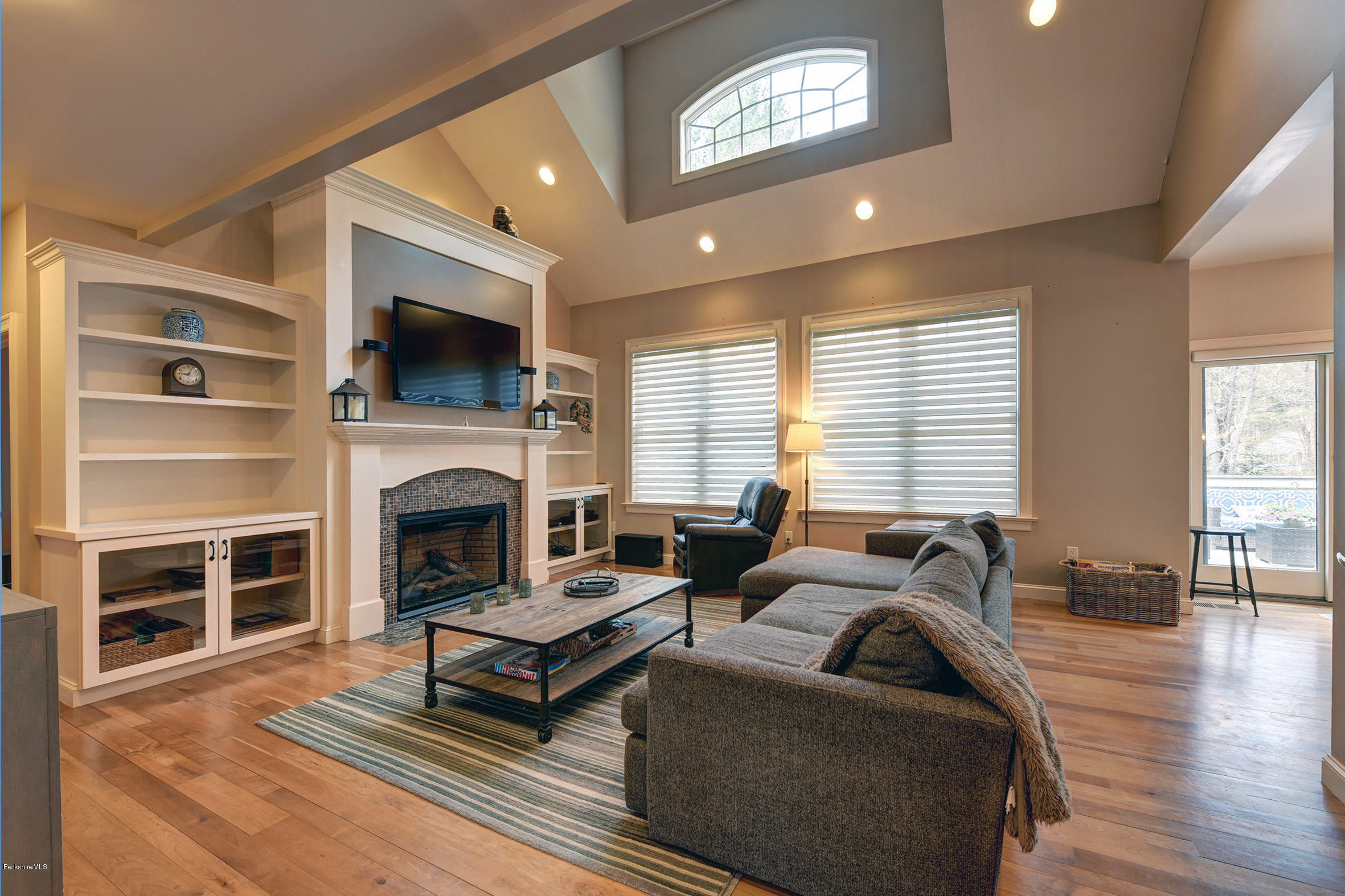 16 Lillybrook Road Pittsfield, MA 01201 - Photo 15 of 38 a living room with furniture a fireplace and a flat screen tv