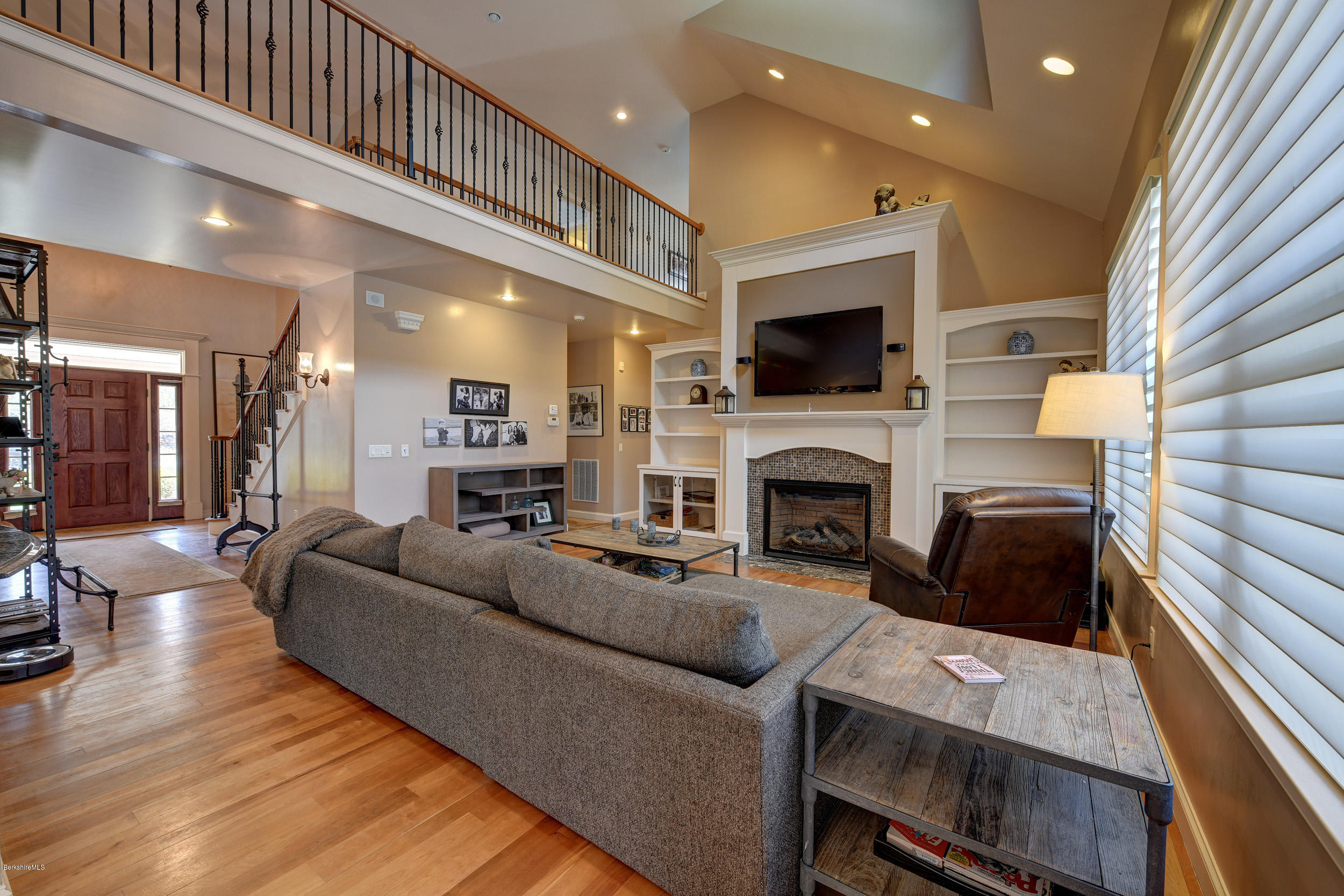 16 Lillybrook Road Pittsfield, MA 01201 - Photo 16 of 38 a living room with furniture a flat screen tv and a fireplace