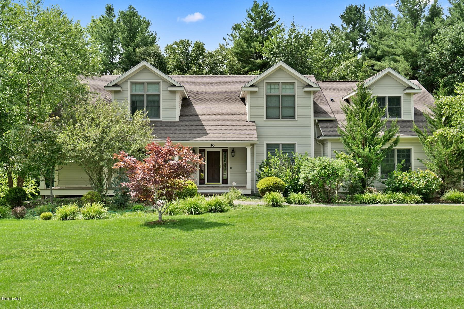 16 Lillybrook Road Pittsfield, MA 01201 - Photo 3 of 38 a front view of a house with a garden and plants