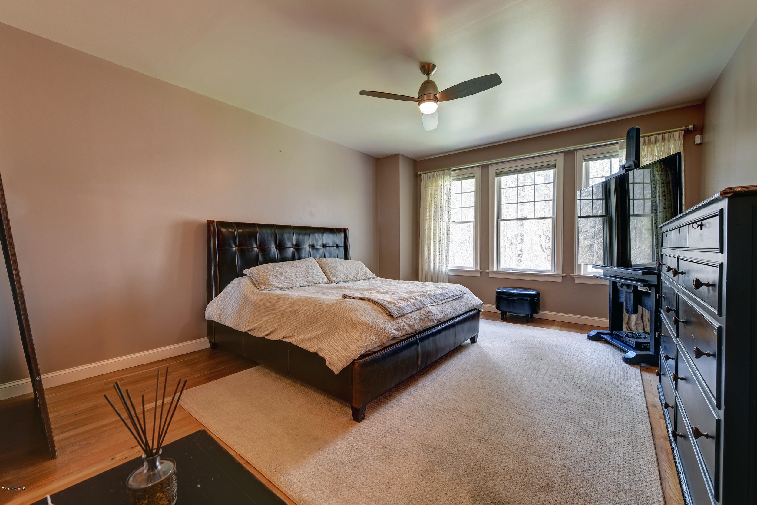 16 Lillybrook Road Pittsfield, MA 01201 - Photo 21 of 38 a bedroom with a bed a window and a flat screen tv