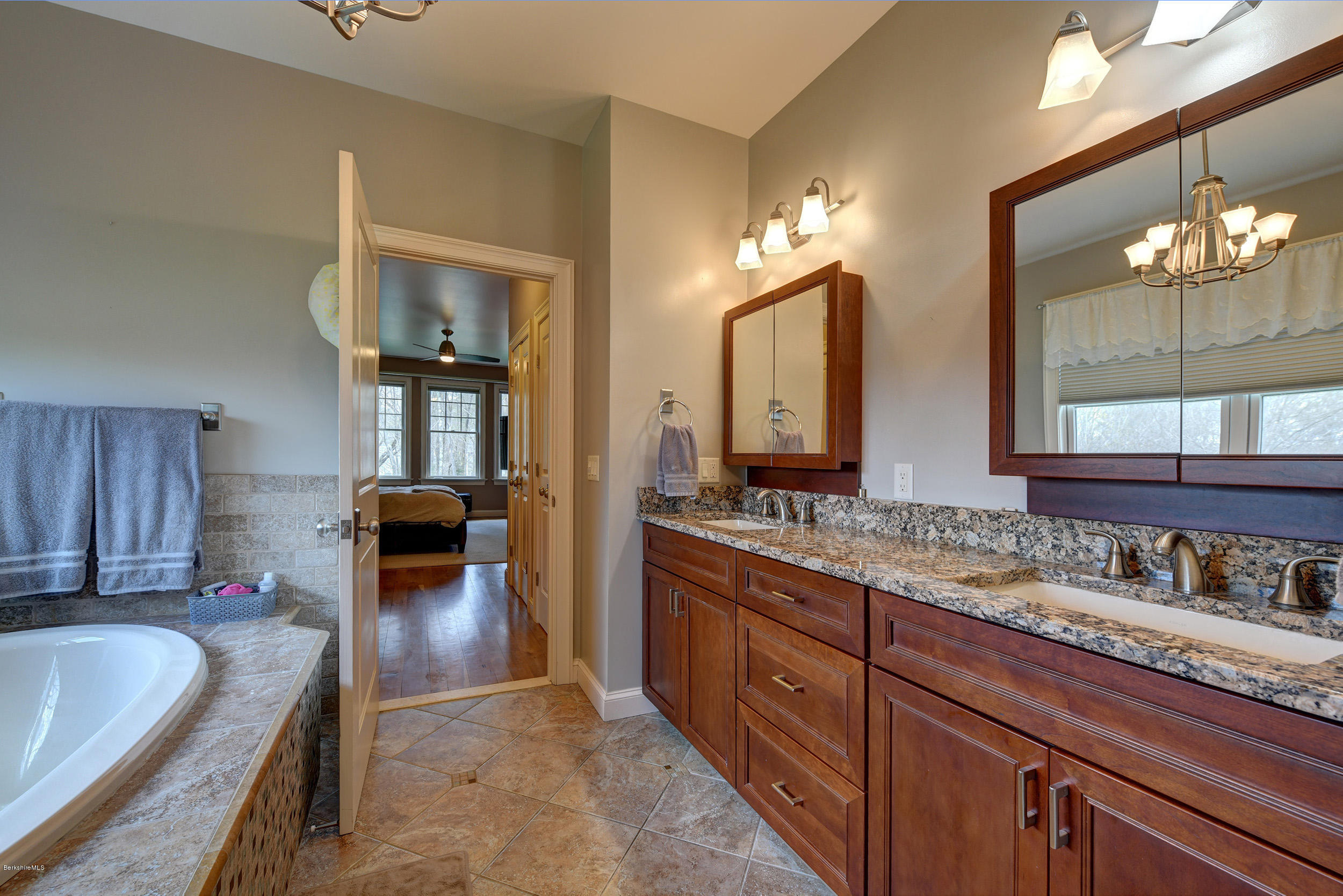 16 Lillybrook Road Pittsfield, MA 01201 - Photo 24 of 38 a spacious bathroom with a granite countertop sink and a large mirror