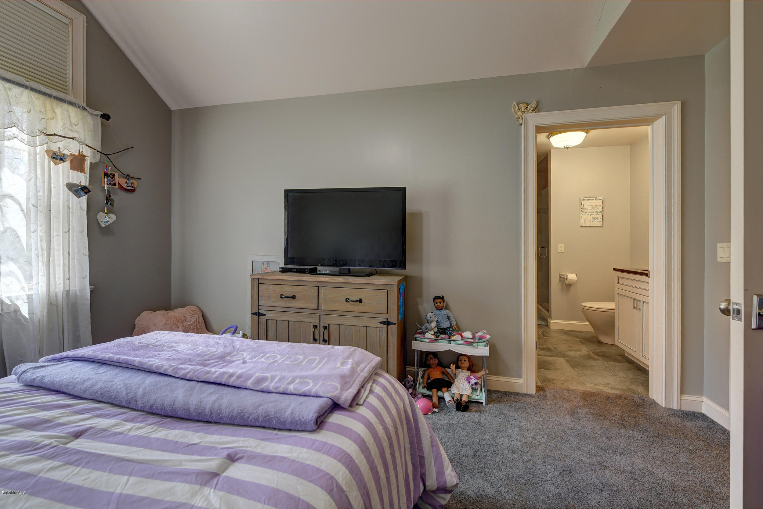 16 Lillybrook Road Pittsfield, MA 01201 - Photo 29 of 38 a bedroom with a bed and a flat screen tv