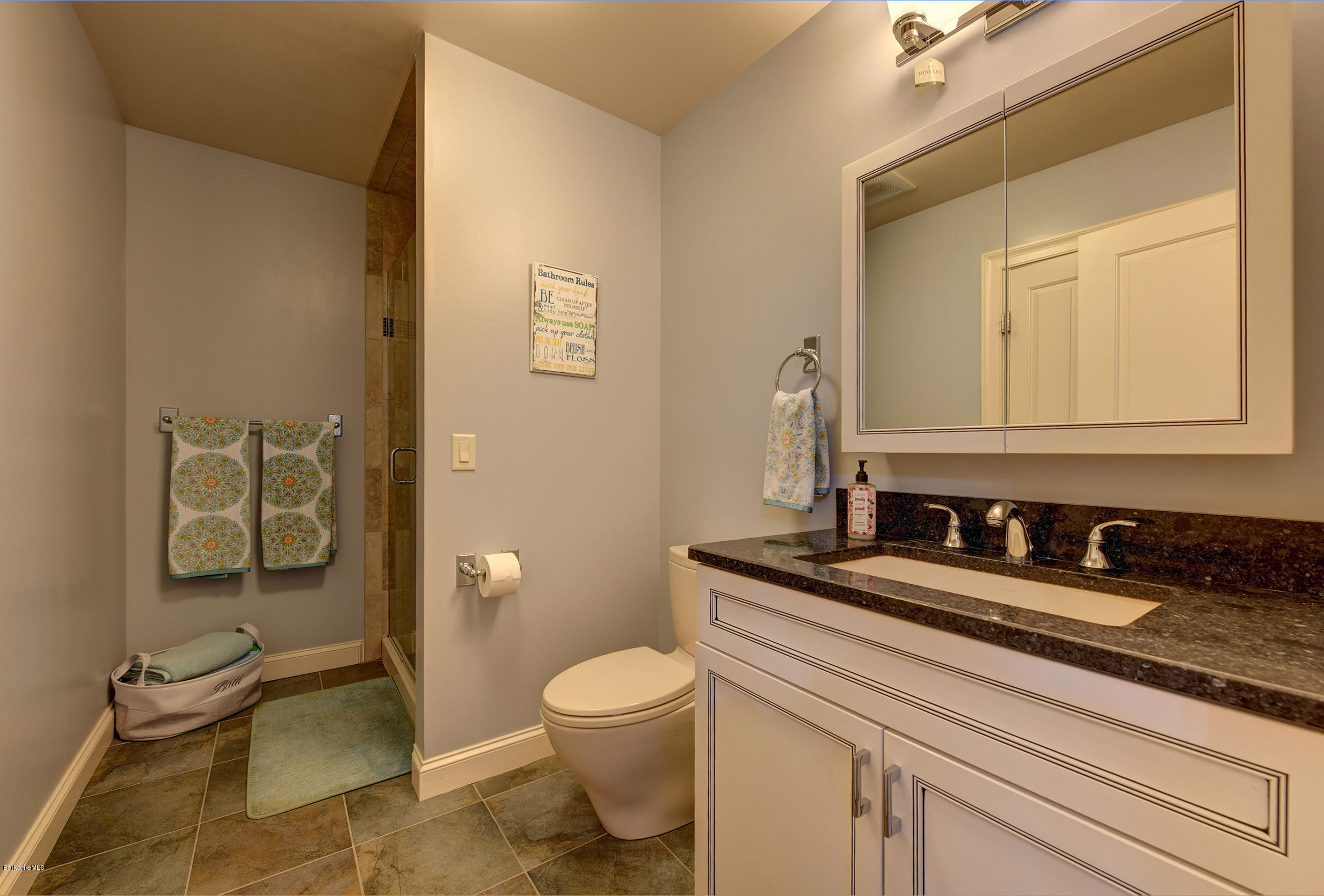 16 Lillybrook Road Pittsfield, MA 01201 - Photo 30 of 38 a bathroom with a granite countertop toilet sink and mirror