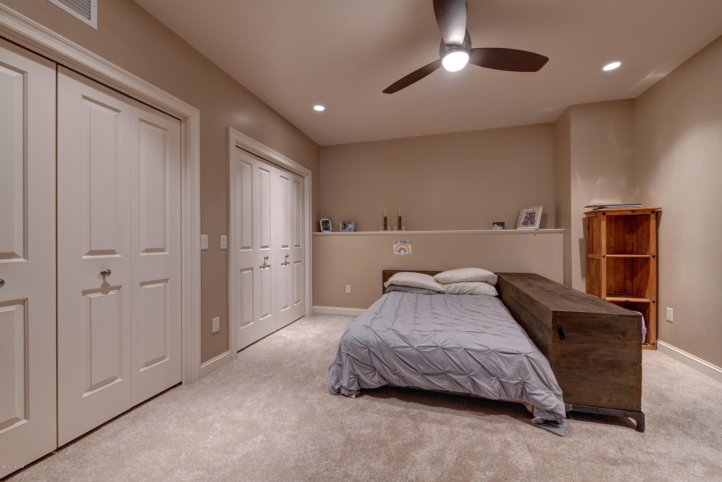 16 Lillybrook Road Pittsfield, MA 01201 - Photo 38 of 38 a bedroom with a bed and a chandelier