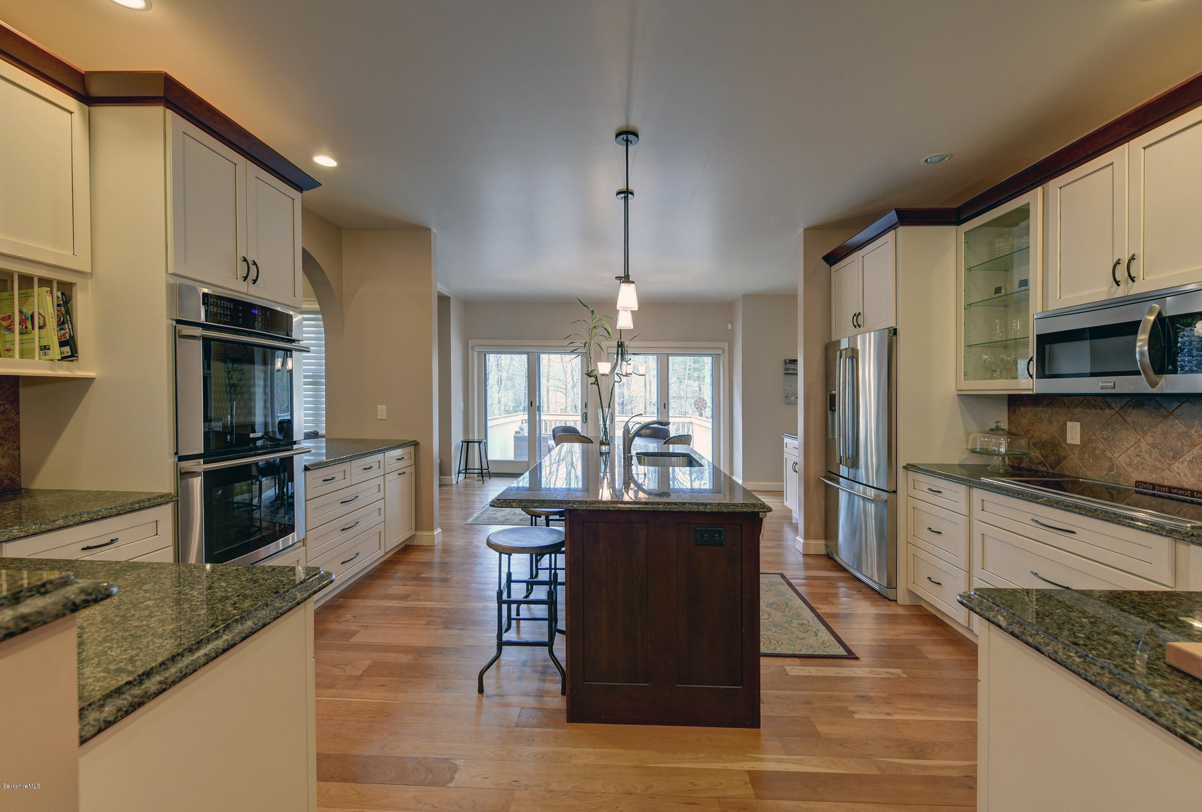 16 Lillybrook Road Pittsfield, MA 01201 - Photo 9 of 38 a kitchen with stainless steel appliances granite countertop a refrigerator a stove and a sink with wooden floor