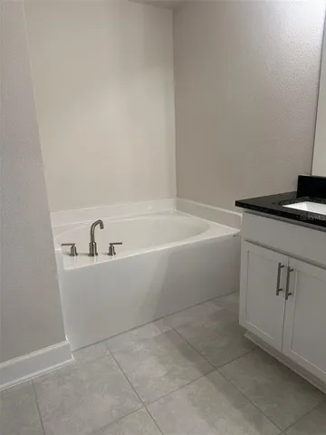 a white bath tub sitting in a bathroom