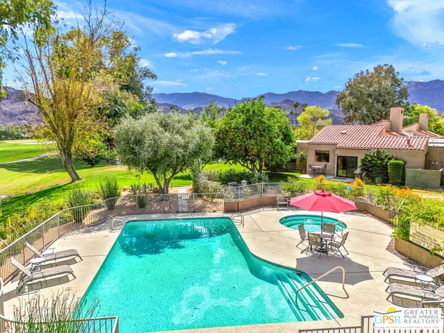 a view of a swimming pool with lounge chair