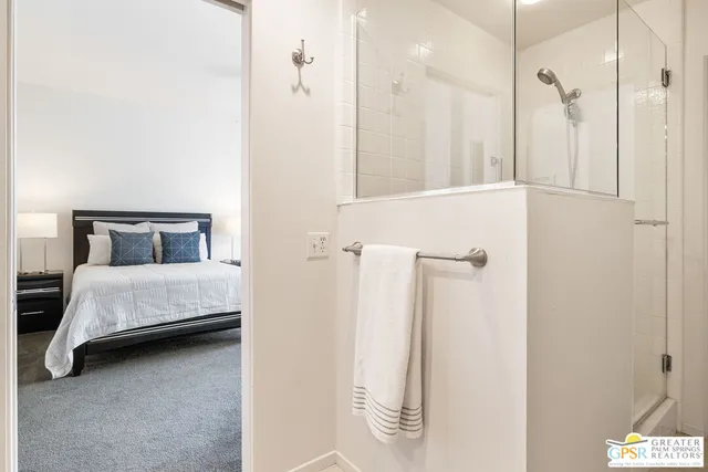 a bedroom with a bed and a cabinets