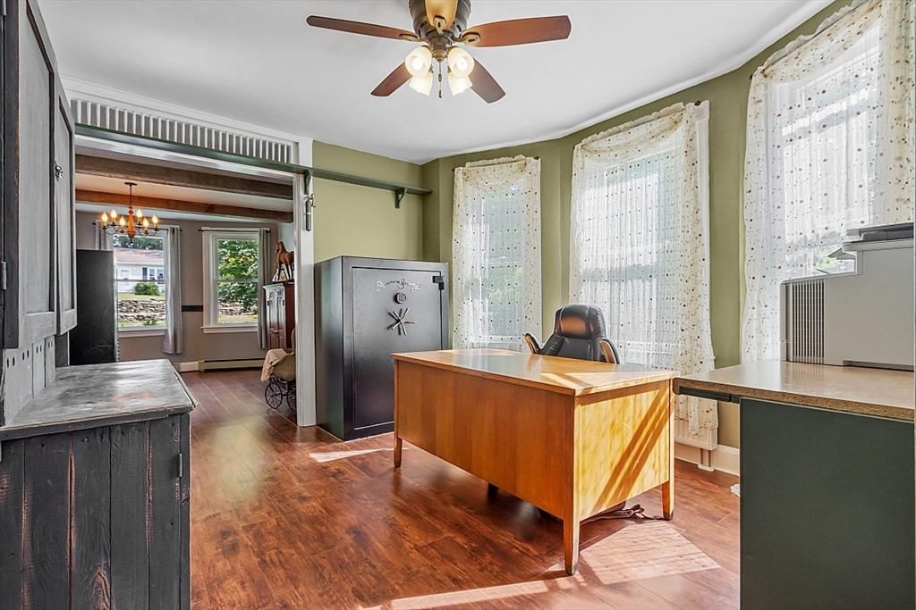 304 Patriots Road Templeton, MA 01468 - Photo 14 of 39 a living room with furniture a flat screen tv and a large window