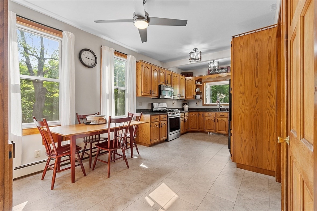 304 Patriots Road Templeton, MA 01468 - Photo 15 of 39 a view of a kitchen with furniture and stainless steel appliances