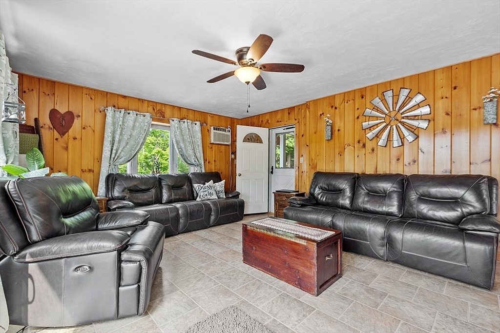 304 Patriots Road Templeton, MA 01468 - Photo 20 of 39 a living room with furniture a ceiling fan and a large window