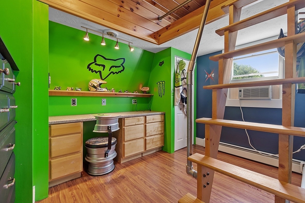 304 Patriots Road Templeton, MA 01468 - Photo 27 of 39 a room with wooden floor and windows