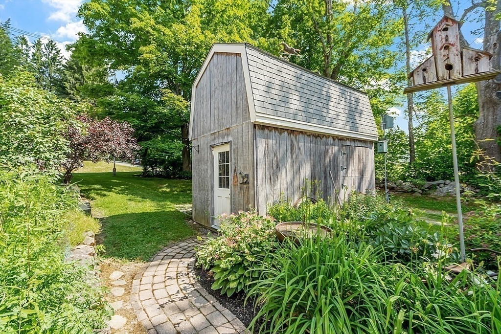 304 Patriots Road Templeton, MA 01468 - Photo 36 of 39 a backyard of a house with lots of green space