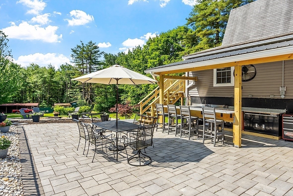 304 Patriots Road Templeton, MA 01468 - Photo 7 of 39 a view of a dinning tables and chairs in the patio
