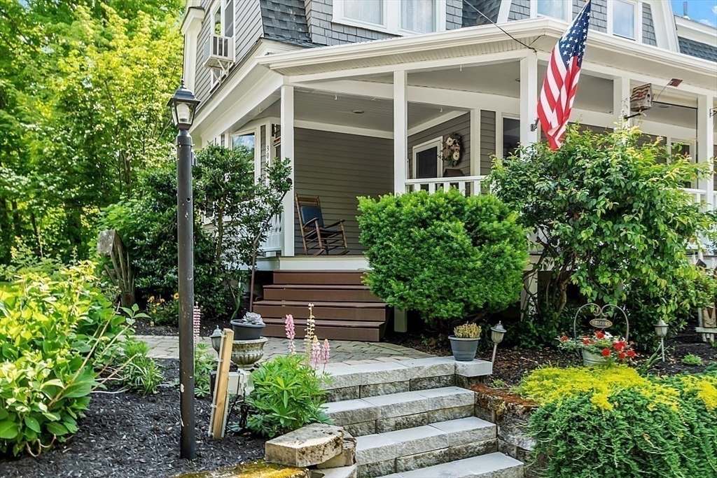 304 Patriots Road Templeton, MA 01468 - Photo 9 of 39 a front view of a house with plants and trees
