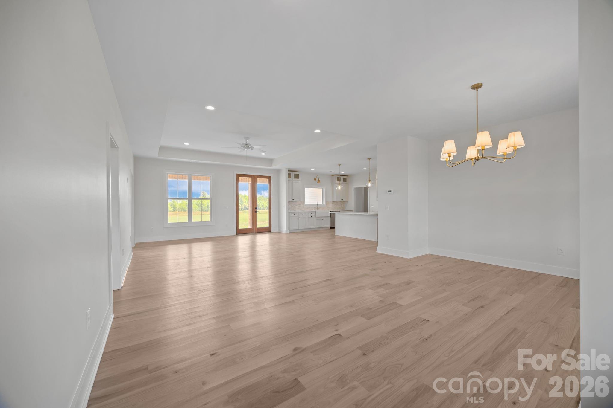 4805 Patterson Road China Grove, NC 28023 - Photo 12 of 42 a view of an empty room with a window and wooden floor