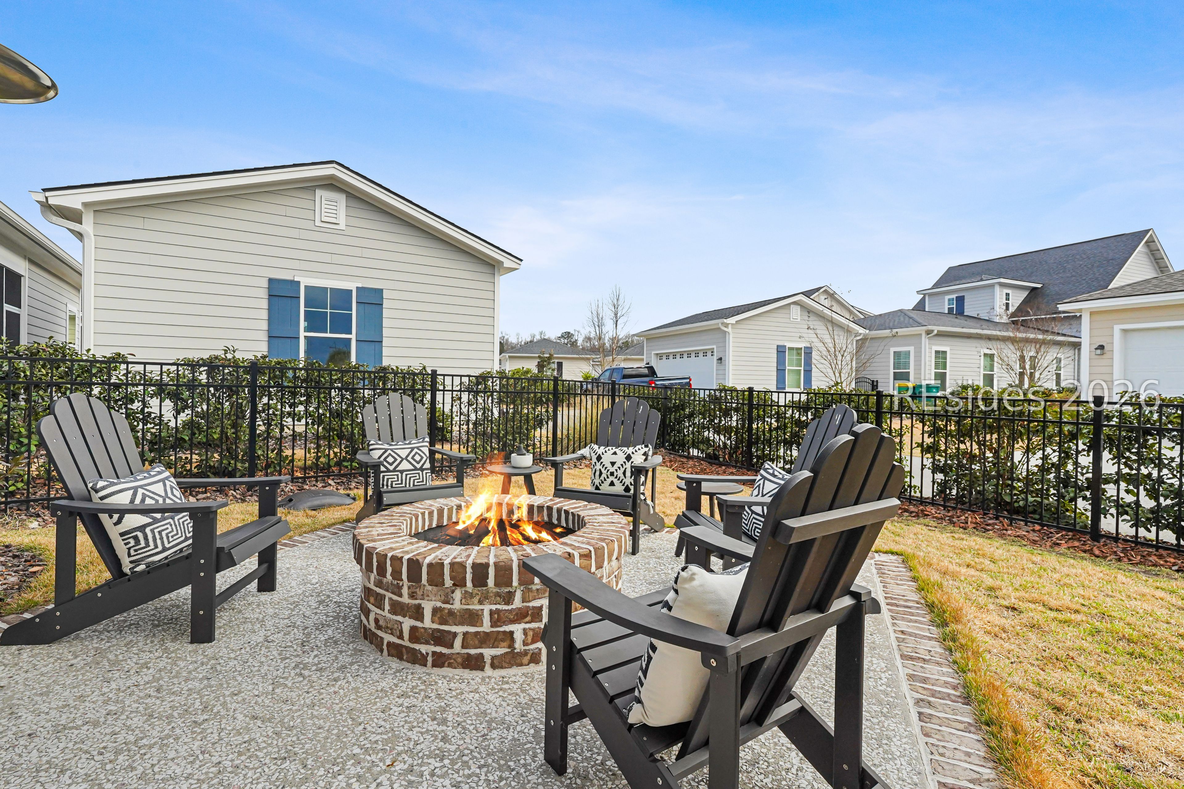 93 Anchor Bend Bluffton, SC 29910 - Photo 32 of 54 Patio with wood burning fire pit and fenced yard