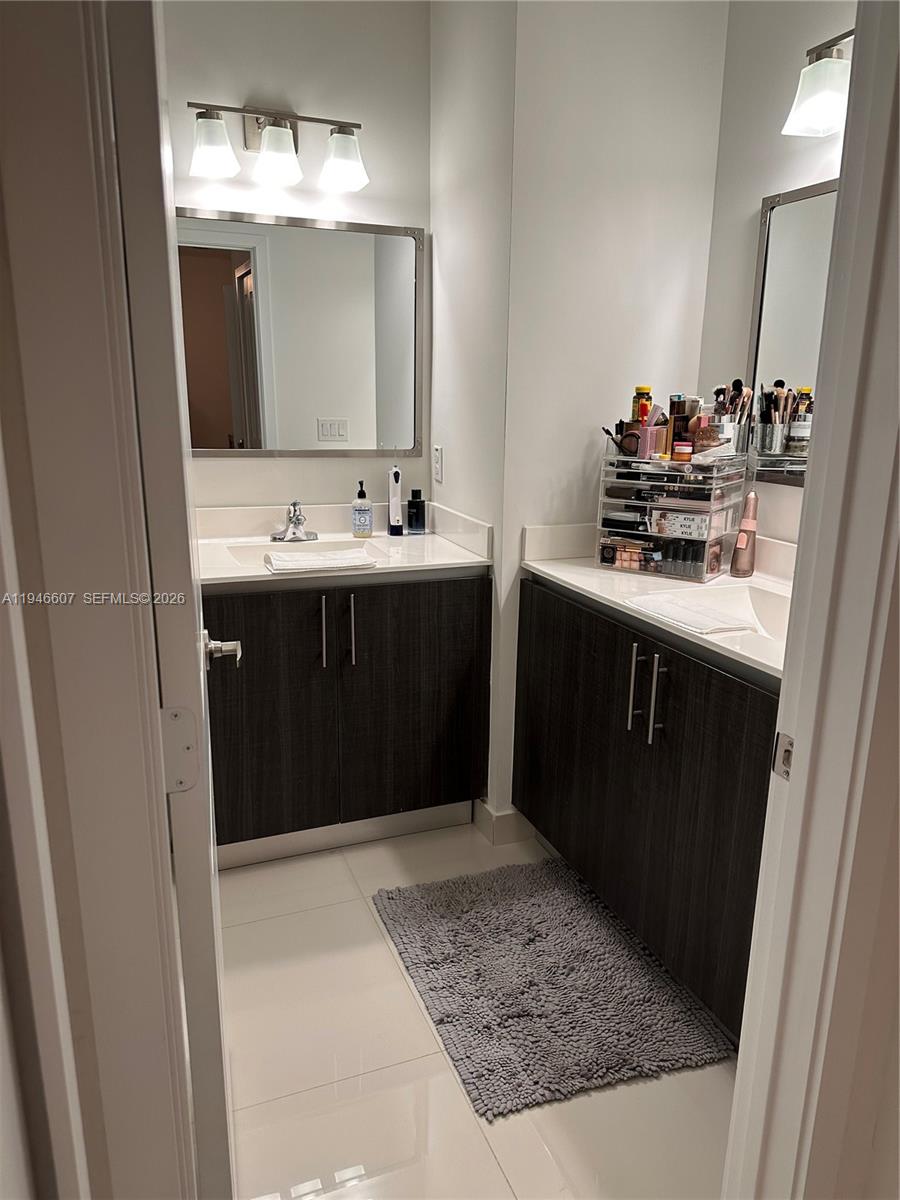 507 Southwest 91st Court, Unit 507 Miami, FL 33174 - Photo 7 of 15 a bathroom with a sink and a mirror