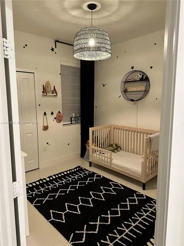 a view of a hallway and wooden floor with entryway