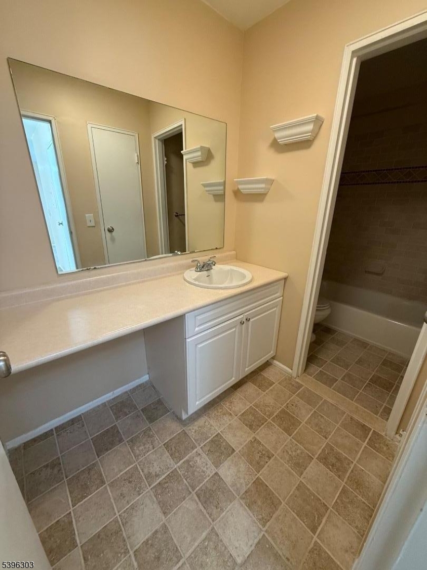 680 Highway 15, Unit 41 Lake Hopatcong, NJ 07849 - Photo 11 of 18 a bathroom with a sink a mirror and a bathtub