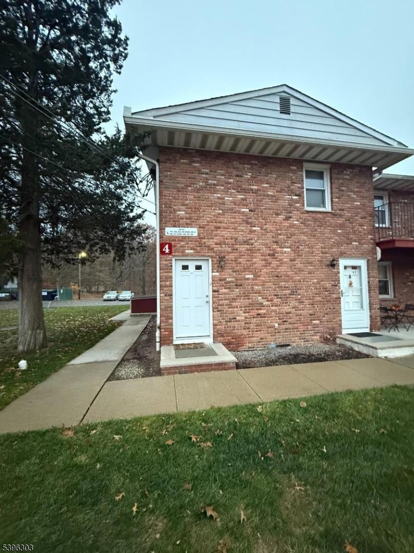 680 Highway 15, Unit 41 Lake Hopatcong, NJ 07849 - Photo 2 of 18 a front view of a house with garden