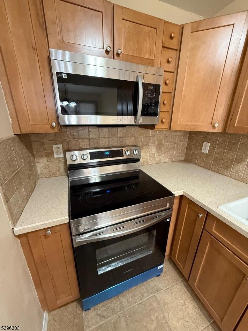 680 Highway 15, Unit 41 Lake Hopatcong, NJ 07849 - Photo 8 of 18 a stove top oven sitting inside of a kitchen