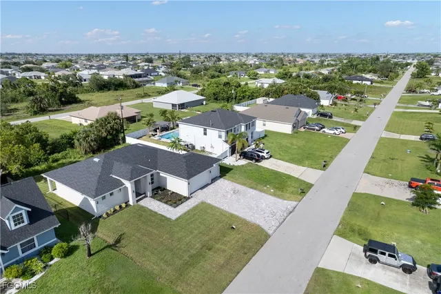 an aerial view of a house with a garden