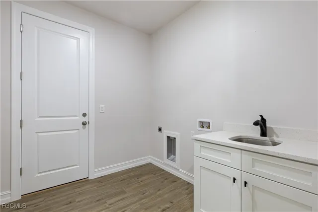 a bathroom with a sink and vanity