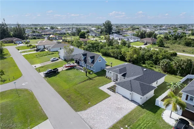 an aerial view of a house with a garden