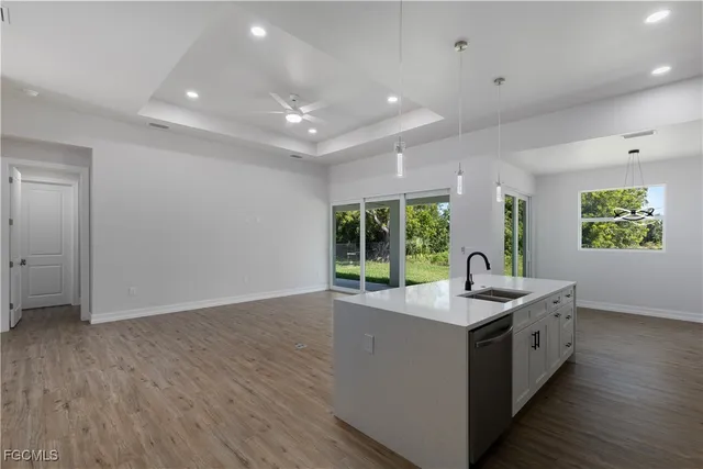 a kitchen with a sink and large window