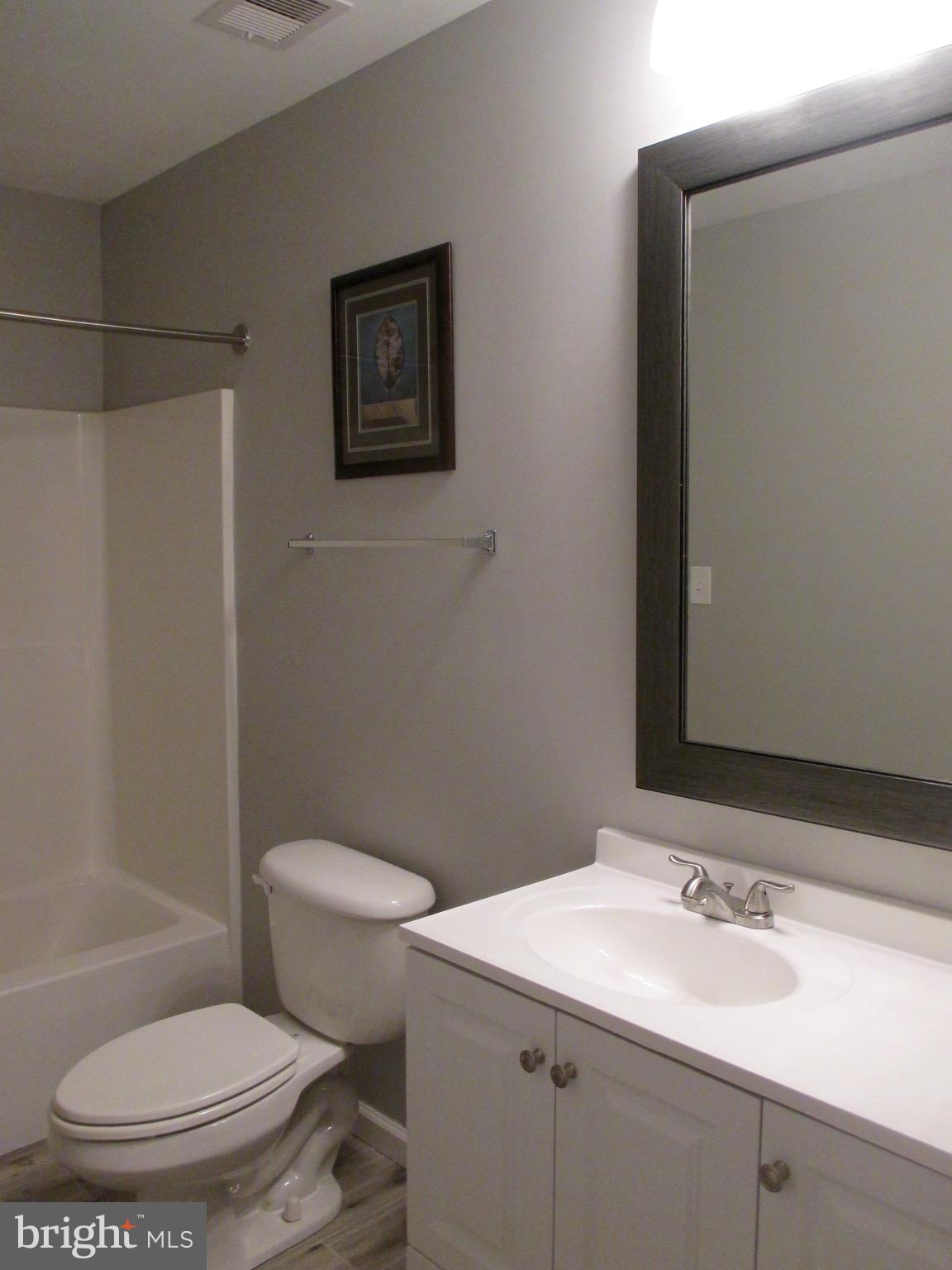 6300 Lincolnia Road Alexandria, VA 22312 - Photo 21 of 30 a bathroom with a sink a toilet and shower