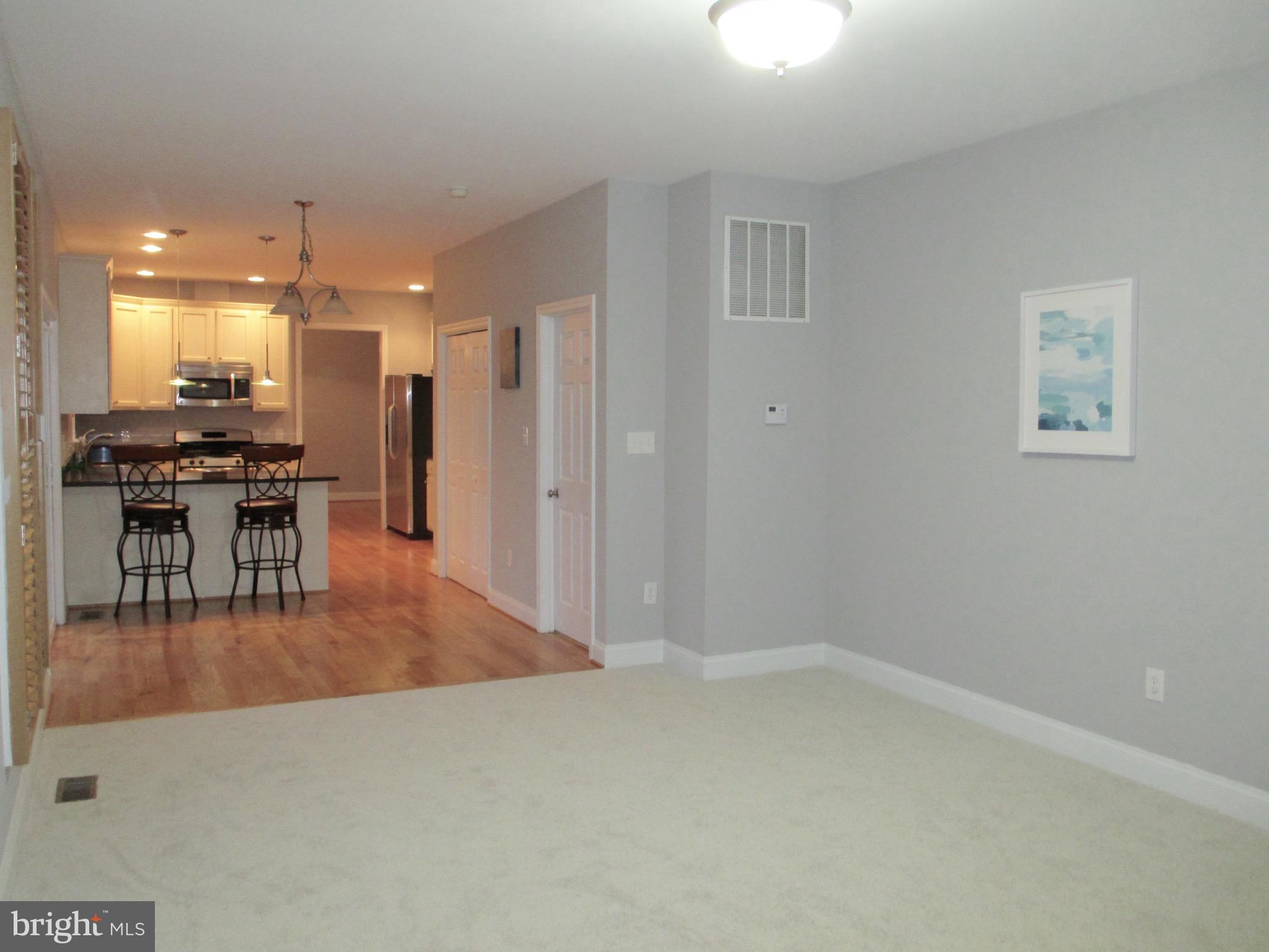 6300 Lincolnia Road Alexandria, VA 22312 - Photo 8 of 30 a dining hall with a dining table chairs and a chandelier
