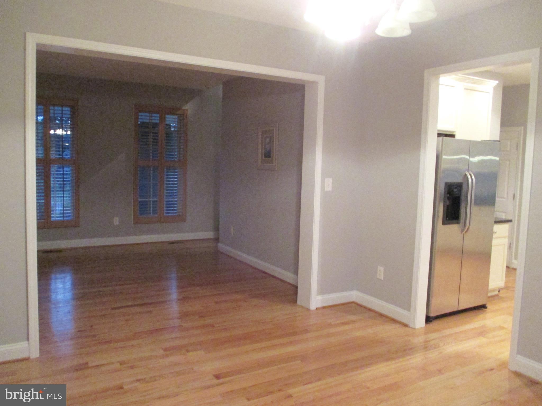 6300 Lincolnia Road Alexandria, VA 22312 - Photo 10 of 30 an empty room with wooden floor and windows