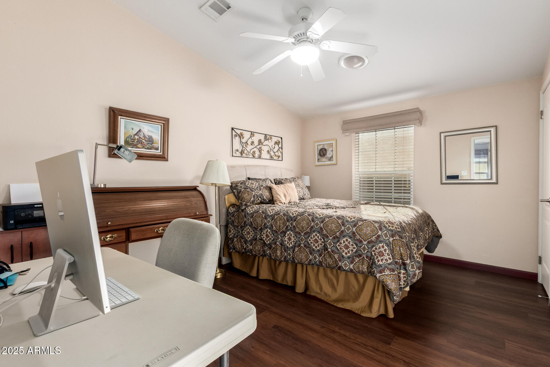 11201 North El Mirage Road, Unit F16 El Mirage, AZ 85335 - Photo 20 of 29 a bedroom with a bed and a chair