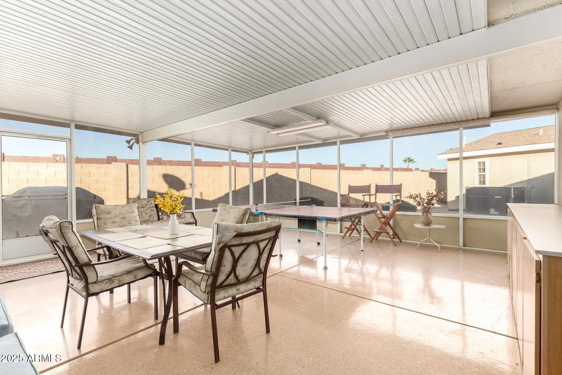 11201 North El Mirage Road, Unit F16 El Mirage, AZ 85335 - Photo 24 of 29 a view of a patio with table and chairs