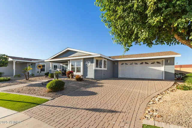 a front view of house with yard and seating area