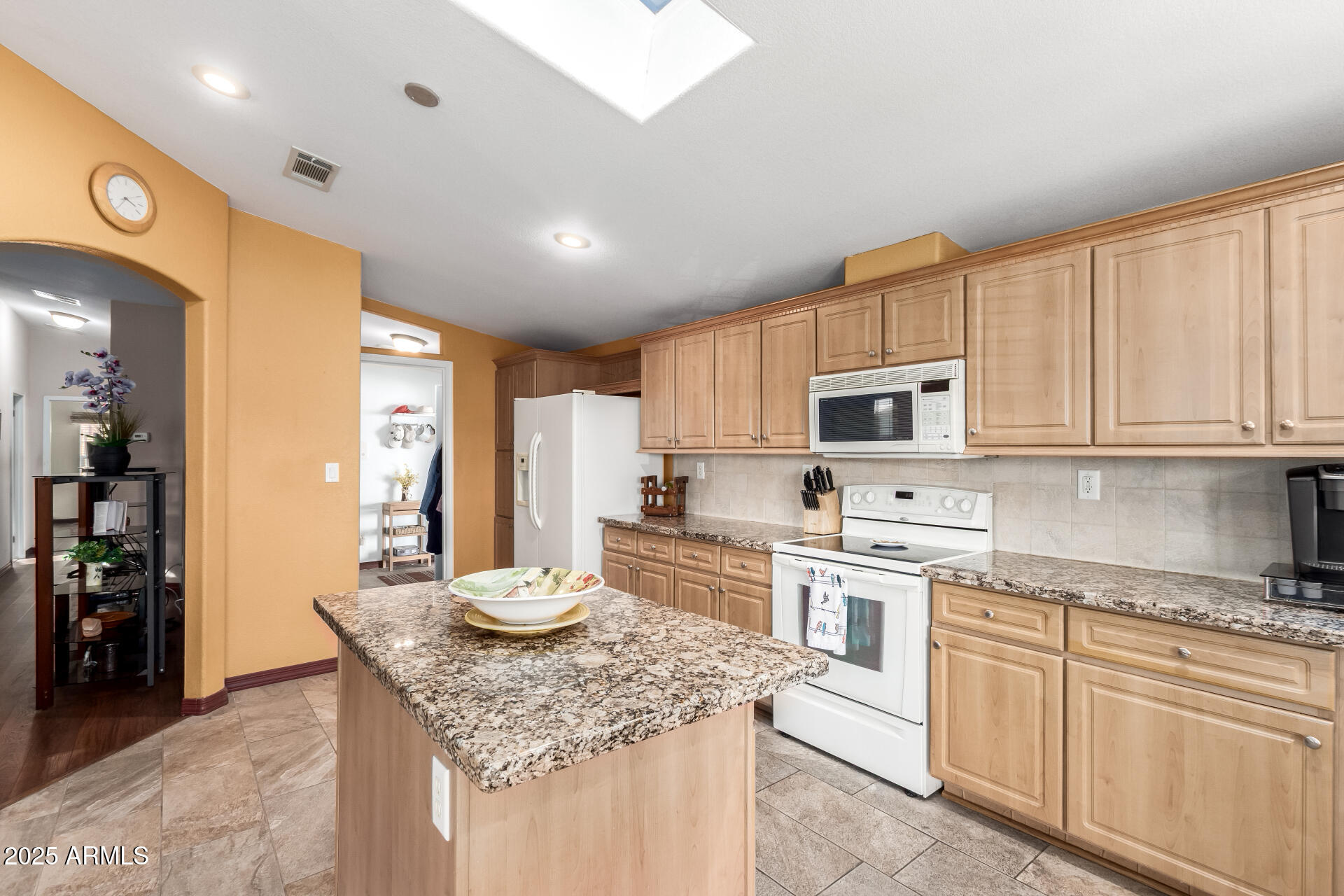 11201 North El Mirage Road, Unit F16 El Mirage, AZ 85335 - Photo 10 of 29 a kitchen with stainless steel appliances granite countertop a lot of counter space cabinets and a sink