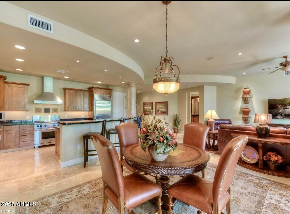 8 Biltmore Estate, Unit 112 Phoenix, AZ 85016 - Photo 5 of 14 a view of a dining room with furniture
